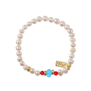 Handmade freshwater pearl bracelet with red carnelian beads and gold-tone metal charms
