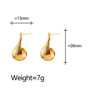 Golden teardrop earrings with brushed metal texture and 26mm height dimension