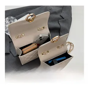 Internal view of beige quilted leather flap bag showing capacity for phone and wallet