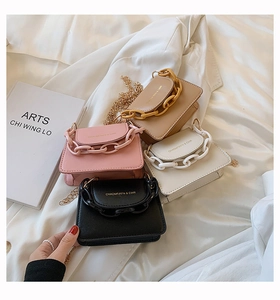 Mini crossbody bags with metal chains and acrylic links in multiple candy colors