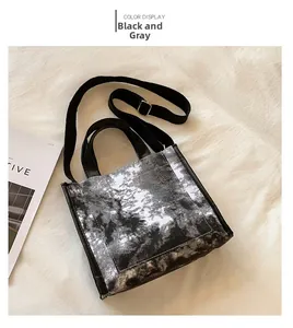 Top view of black grey tie-dye canvas tote bag with soft fabric and leather handles