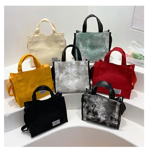 Detail showing seven color options and marble tie-dye patterns on canvas tote bags