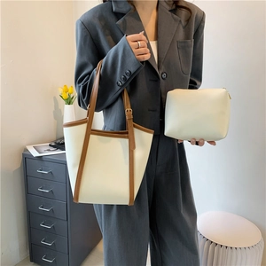 Chic off-white large capacity tote bag with brown leather trim and inner pouch for women