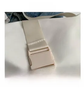 Macro detail of high-quality nylon strap and beige plastic buckle on casual crossbody bag