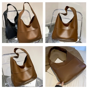 Detail shot of the vintage PU leather texture and front pocket on the large hobo tote bag