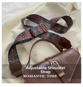 Detail of adjustable bohemian strap with gold buckle on brown vintage PU handbag