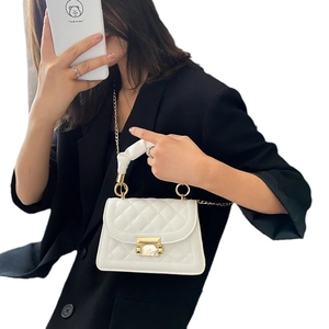 White quilted chain flap bag with silk wrapped handle and golden twist lock for women
