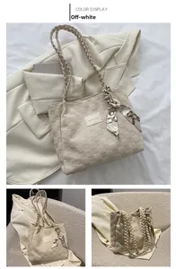 Detail of off-white checkered tote bag with patterned silk scarf and woven straps