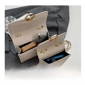 Detail showing the internal storage and capacity for large and small quilted chain bags