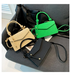 Three minimalist woven handbags in green, beige, and black with knotted rope handles