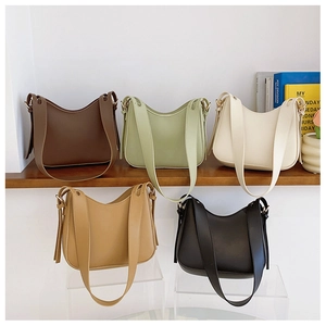 Collection of minimalist faux leather underarm bags in brown, green, white, tan and black
