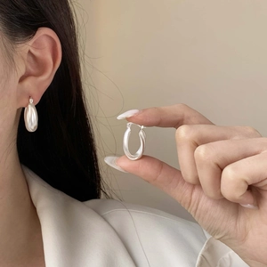Elegant U-shaped silver chunky earrings with a matte finish and minimalist geometric design