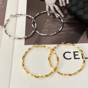 Chic geometric spiral twisted hoop earrings in gold and silver finishes for women