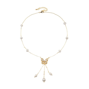 Elegant gold necklace featuring a diamond-studded butterfly pendant and pearl tassels