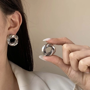 Minimalist double layer concentric hollow silver stud earrings with geometric knot design