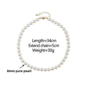 Detail showing 8mm white pearls with golden lobster clasp and 5cm extension chain