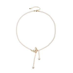 Elegant pearl choker necklace with a gold butterfly zircon pendant and long tassels