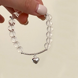 Summer transparent crystal beaded bracelet with a polished silver heart pendant