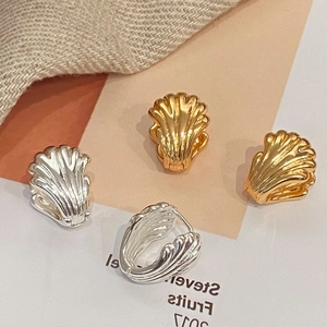 Shell-shaped double layer wing huggie earrings in 18K gold and silver plated finish