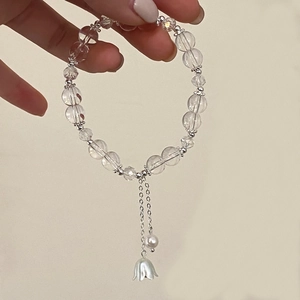 Bracelet en perles de cristal transparent avec pendentif fleur argentée et pampilles