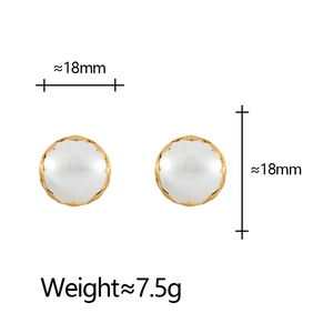 Detail of round 18mm gold plated earrings with white mother of pearl inlay and 7.5g weight