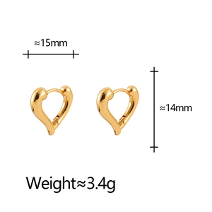 Detailed view of heart-shaped gold huggie earrings with dimensions 15mm by 14mm