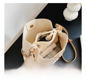 Top view showing the spacious interior compartments and floral scarf detail of the bucket bag