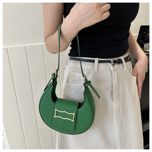 Green crescent shoulder bag detail, stylish hobo purse with metal buckle flap design.