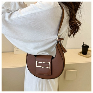 Chic brown crescent shoulder bag for women, minimalist hobo underarm bag with stylish buckle.