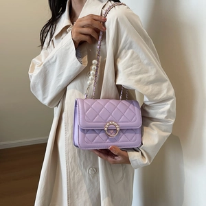 Lavender quilted crossbody bag with pearl embellishments and golden chain strap