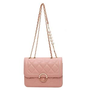 Pink quilted shoulder bag with faux pearl ring lock and gold chain strap in a studio shot