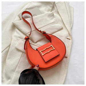 Orange crescent underarm shoulder bag with metal clasp detail, stylish daily accessory.