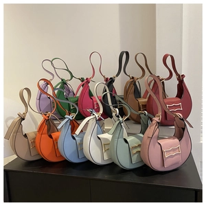 Multicolor crescent shoulder bag detail view showing vibrant leather underarm handbag styles.