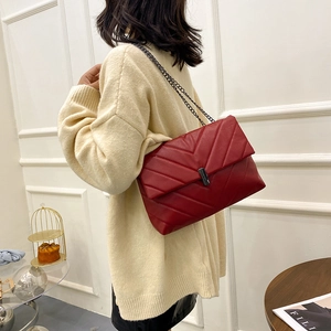 Deep red quilted chain crossbody bag for women with V-stitch pattern and metal clasp