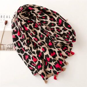 Soft leopard print long scarf in rose pink and beige with decorative fringe tassels