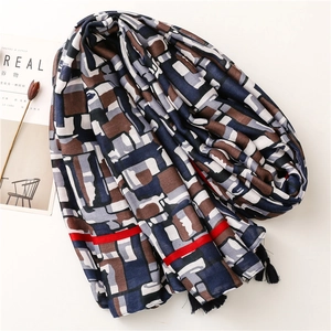 Long soft cotton-linen feel scarf with geometric print and decorative fringe tassels