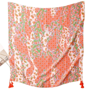 Orange geometric diamond print scarf with green accents and fringe tassels for women