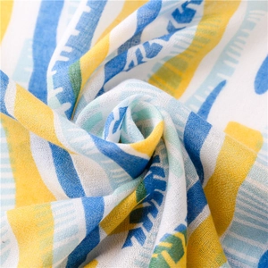 Detailed macro view showing the soft woven texture and blue-yellow striped patterns