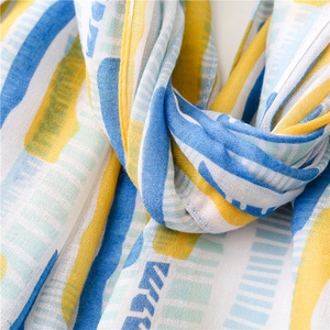 Detailed view of colorful geometric stripes on lightweight breathable summer shawl fabric
