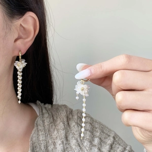 Elegant flower earrings with white pearl tassel chains and gold-tone finish for women