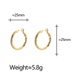 Textured gold twist hoop earrings 25mm diameter with metallic hammered finish and spring clasp