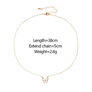Detail view of gold butterfly pendant showing length 38cm and 5cm extension chain
