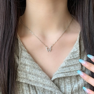 Elegant hollow butterfly necklace with sparkling crystals on a fine silver chain