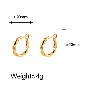 Minimalist golden twisted hoop earrings with 20mm diameter and refined metal texture