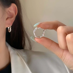 Minimalist S925 sterling silver twisted hoop earrings with elegant spiral texture design