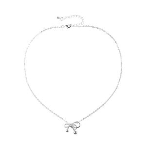 Silver bow necklace with polished metal beads and adjustable chain on a white background