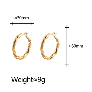 Minimalist matte twisted gold hoop earrings with a 30mm diameter and stylish metal texture
