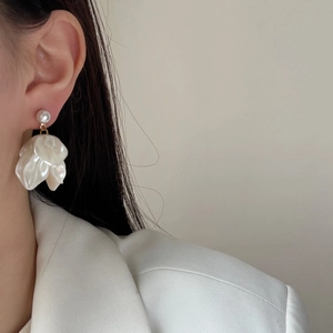 Elegant white petal tassel earrings with pearl accent and golden metal finish