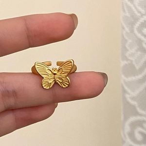 Elegant golden butterfly open ring with textured wings on finger for women