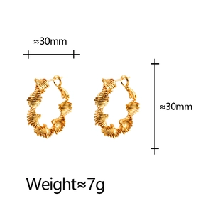 Irregular textured gold hoop earrings featuring geometric design and 30mm diameter